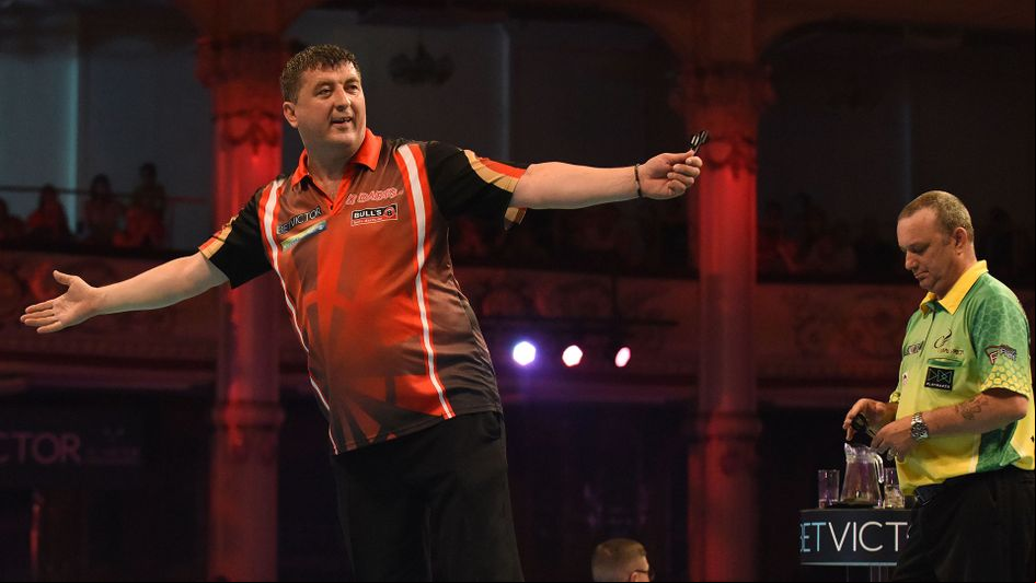 Mensur Suljovic celebrates against Darren Webster (Pic: Lawrence Lustig/PDC)