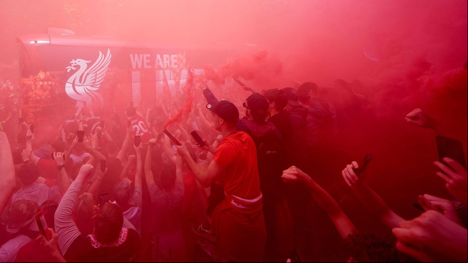 Liverpool fans welcome their team bus