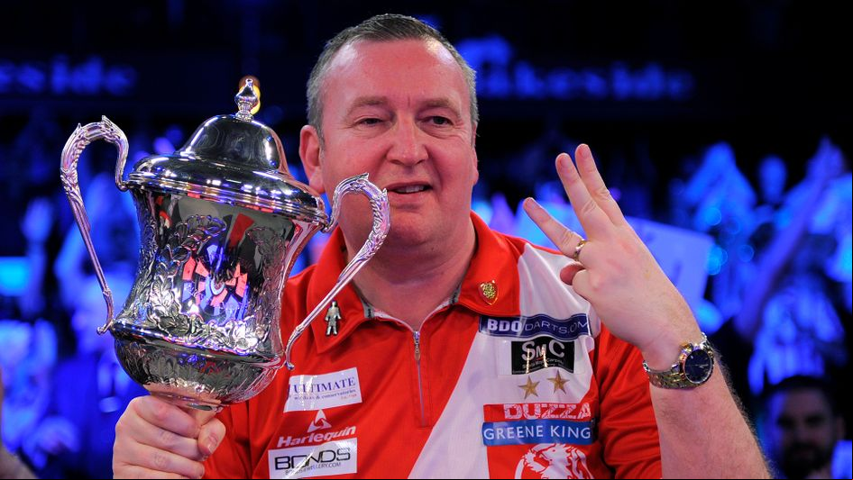 Glen Durrant holds the Lakeside trophy for the third year in a row