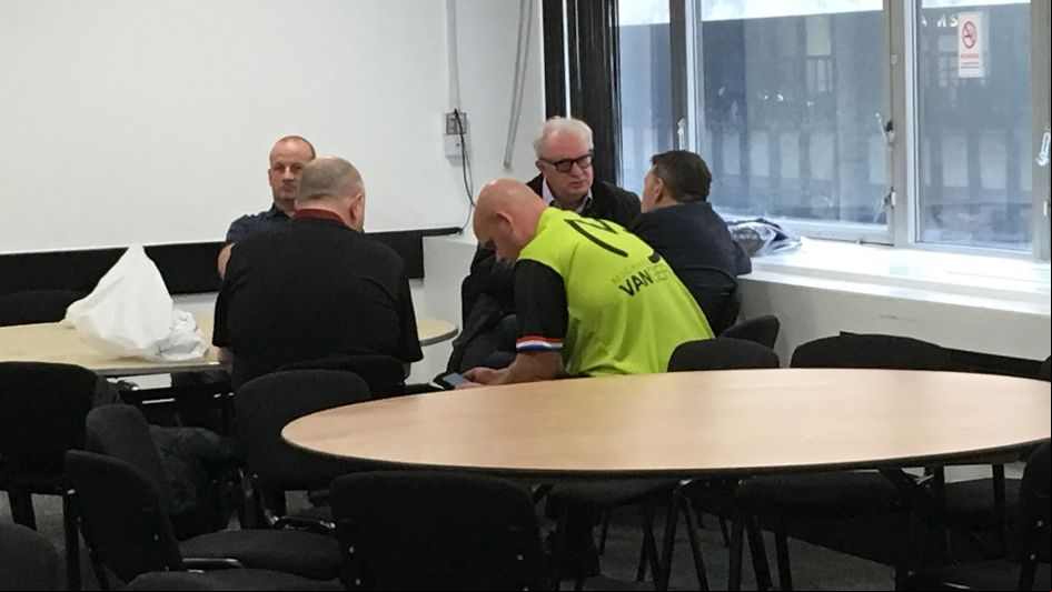 Michael van Gerwen checking some texts before his match later